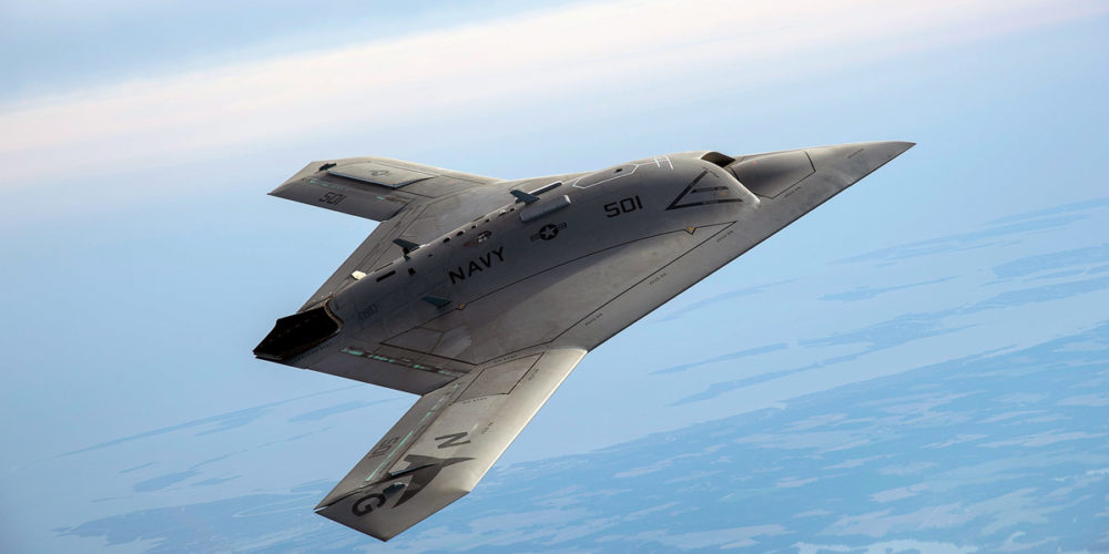 A Northrop Grumman designed aircraft soars through the sky.