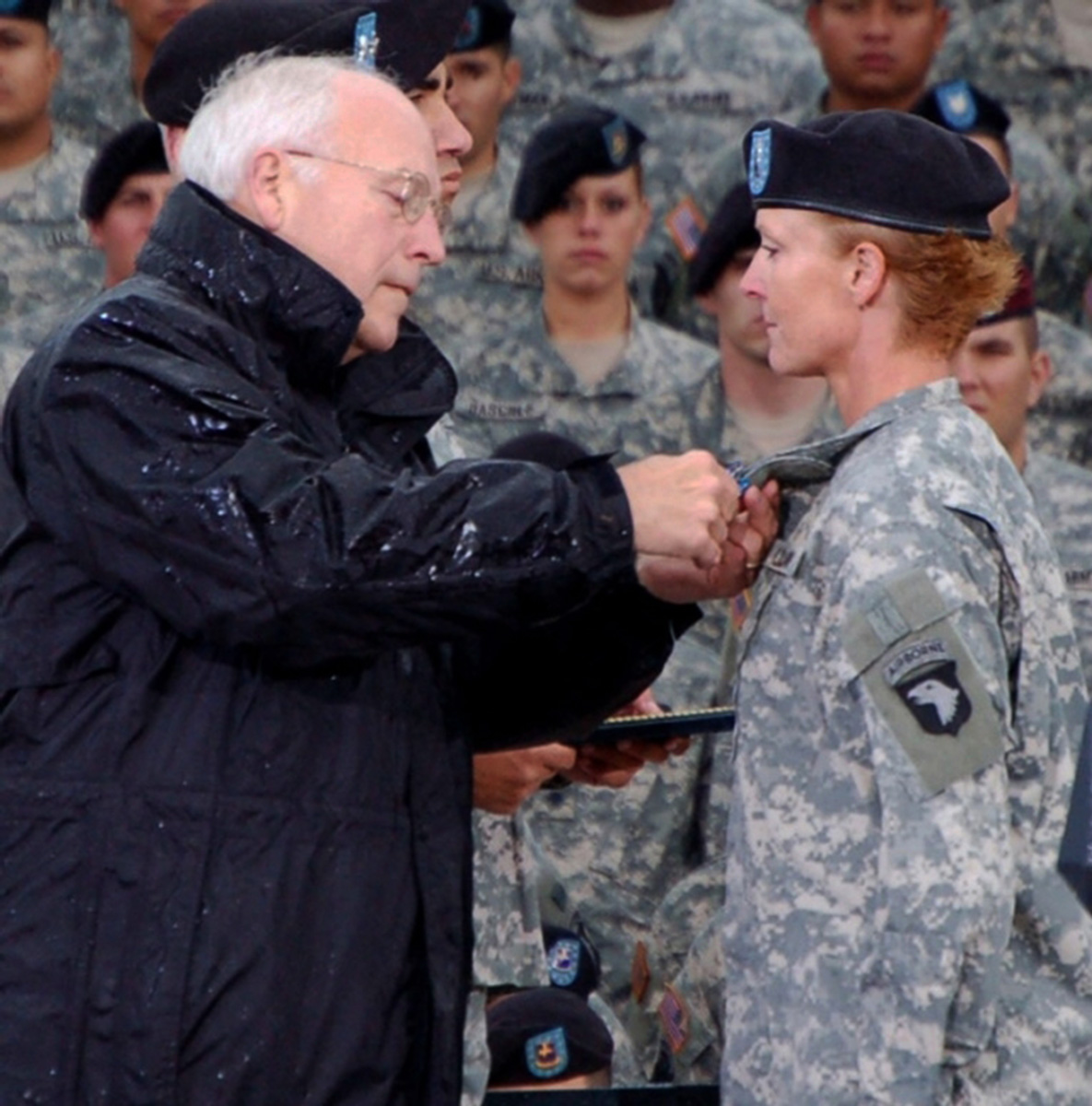 Vice President Dick Cheney presents the Distinguished Flying Cross to Chief Warrant Officer 3 Lori Hill on Oct. 16, 2006. Photo credit: U.S. Army News Service; The appearance of U.S. Department of Defense (DoD) visual information does not imply or constitute DoD endorsement.