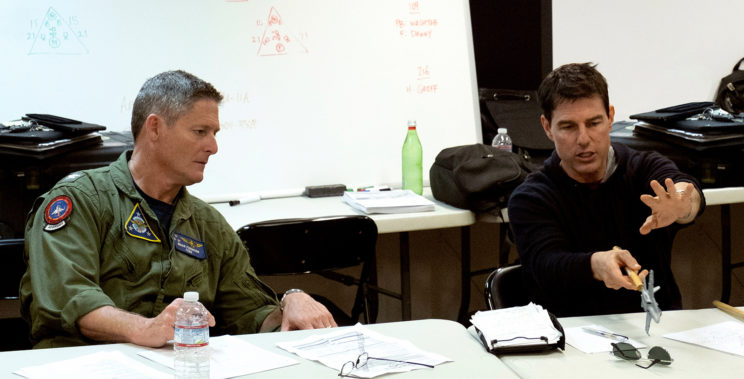 Capt. Brian "Ferg" Ferguson ('93) advises actor Tom Cruise on a flight sequence during the filming of "Top Gun: Maverick."