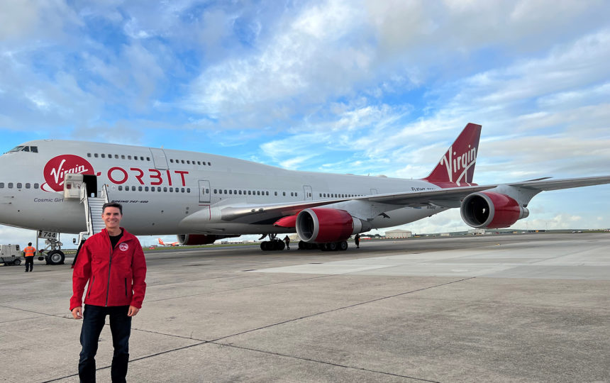 Test pilot Eric Bippert stands in front of Virgin Orbit's Cosmic Girl 747 jet.
