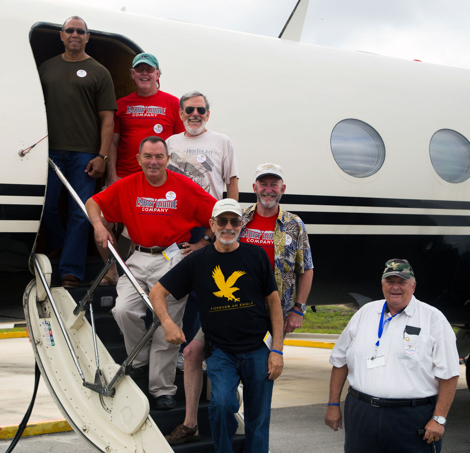 Alumni members of the Alpha Eta Rho professional aviation fraternity enjoy the Fly-In Static Display. (Chris DeAugustine photo)