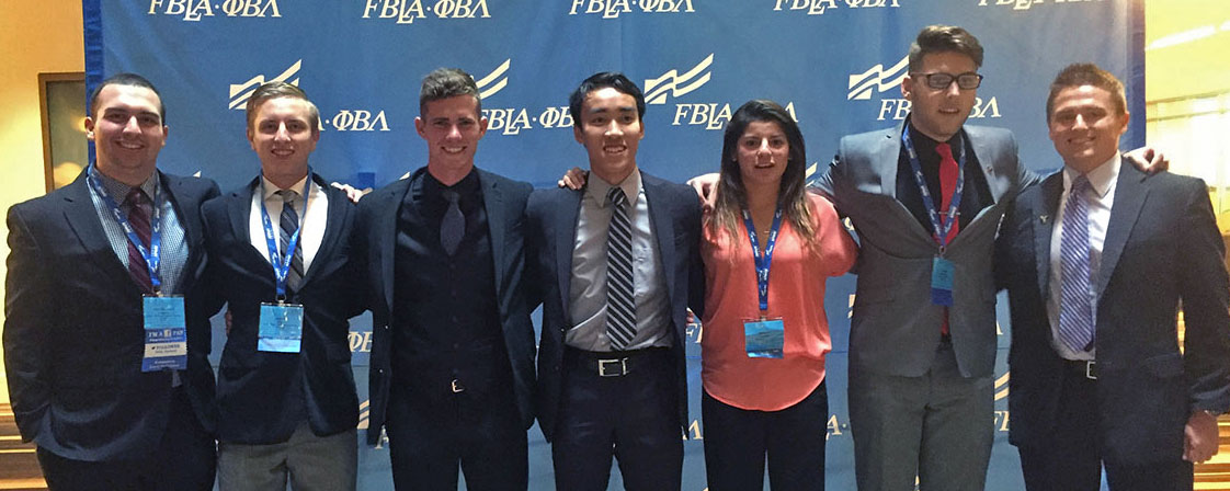 Seven of the 14 students who competed at the National PBL Conference celebrate their accomplishments. Pictured, from left, are John-Michael Linares, Jacob Curl, Trent Marlow, Nicky Ho, Monica Gomez, Zac Greenman and Andy Lamunyon.
