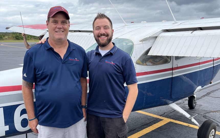 Chris Desjarlais and Mark Hubbert stand in front of Cessna airplane