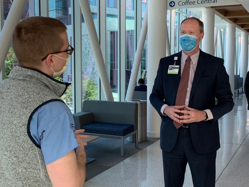 Matt Wain speaks with a colleague at Emory University Hospital