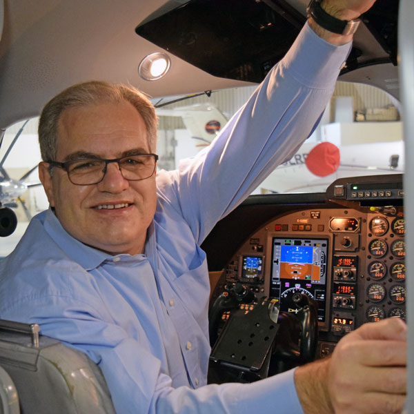 John Maris in an airplane cockpit