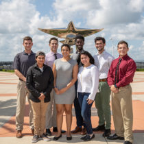 Recipients of FedEd Purple Runway scholarship standing at the ERAU Daytona campus.