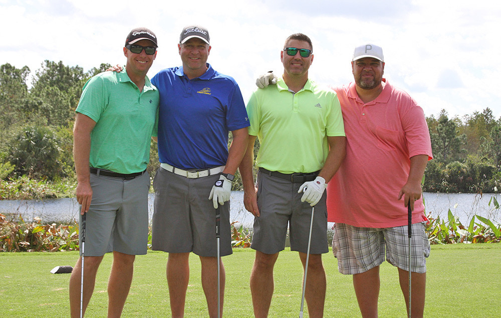 Kevin Hawkins, Johnny Yuzzolin, Mike Magee and Luke Martin at a golf course
