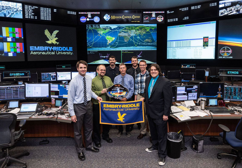 Group of alumni at NASA Mission Control