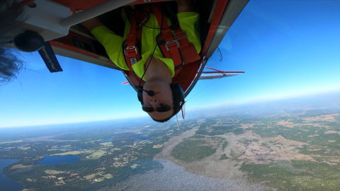Bobby Drouin flies upside-down in a Pitts plane.
