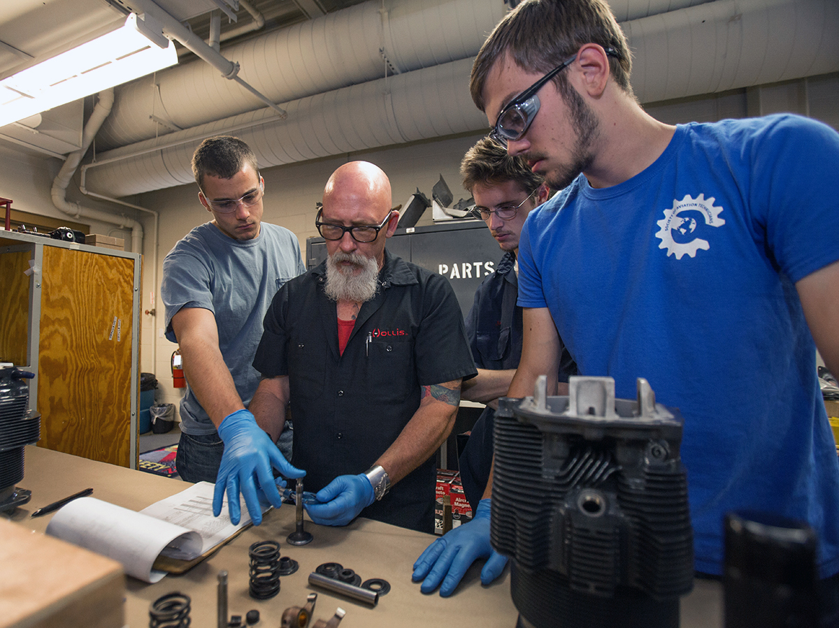 From Left: Jesse Fenner, Tony Cicora, John Bosse and Eric Walterscheid take careful measurements of a valve. (Embry-Riddle/David Massey)