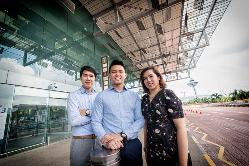 Three Singapore Campus alumni at Changi Airport.