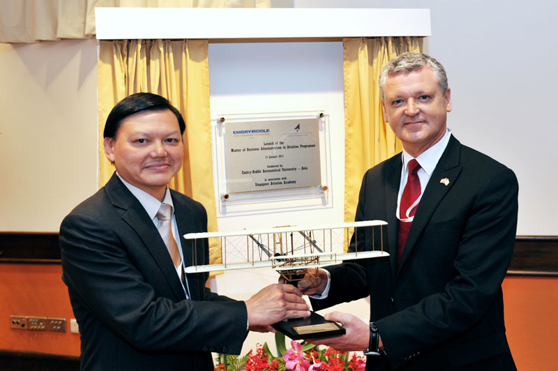 Chancellor John R. Watret, right, and Yap Ong Heng, former director general at CAAS, at the 2011 launch ceremony.