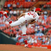 Daniel Ponce de Leon throwing a pitch for the St. Louis Cardinals at a home game.