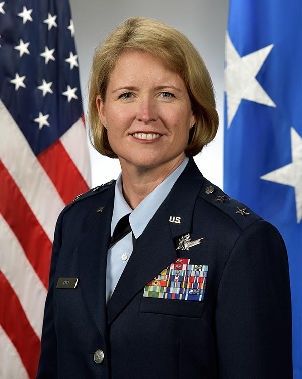 Maj. Gen. Deanna Burt in uniform, posing in front of the US flag
