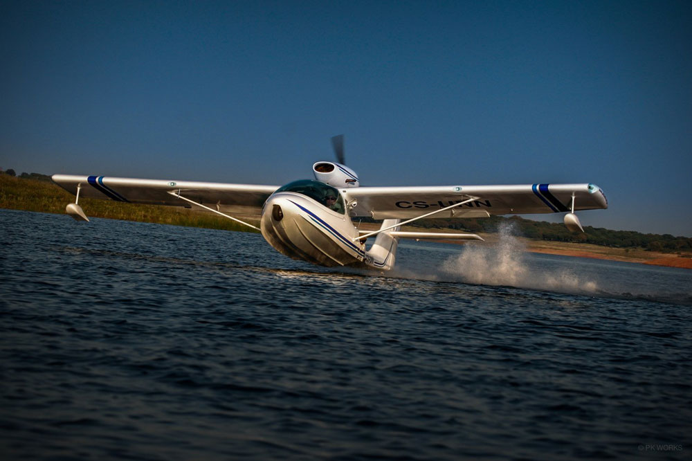 Seamax aircraft taking off from a body of water.