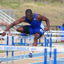Howard Walls Jr. in a hurdling competition