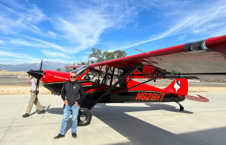 Ken Jillson in front of his Aviat Husky plane.
