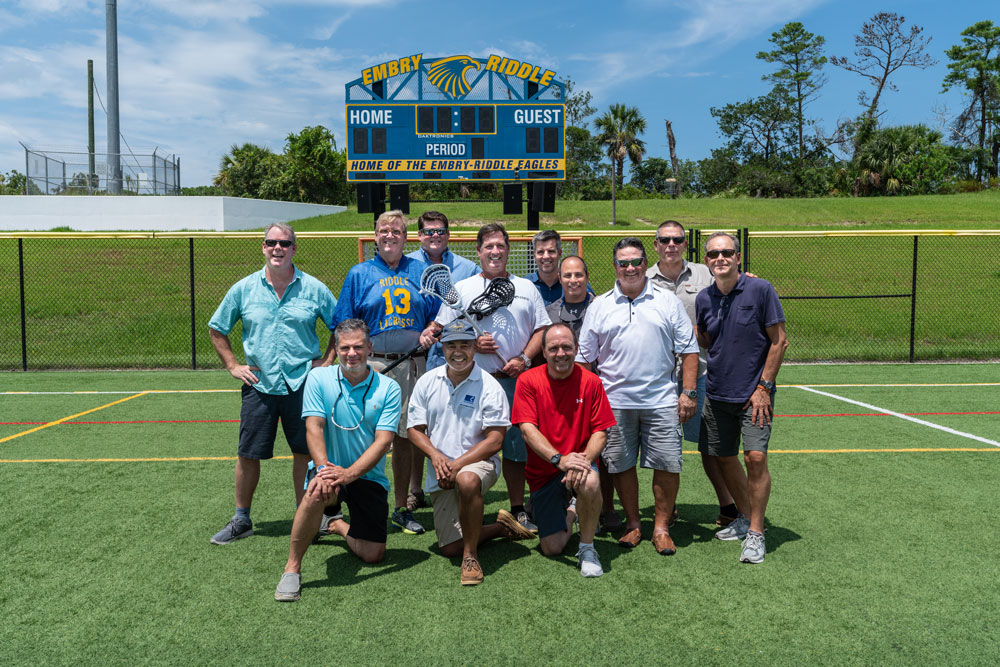 Alumni from the 1988 Embry-Riddle lacrosse team at the lacrosse field in 2018.