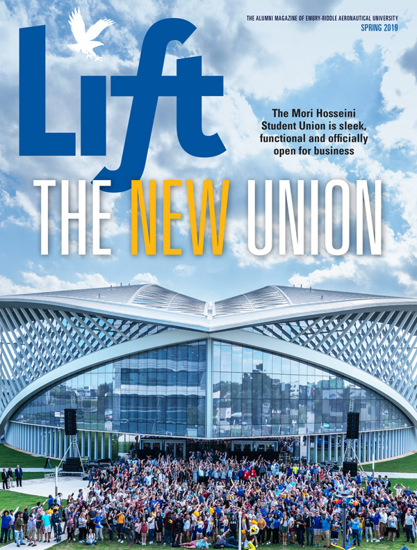Spring 2019 magazine cover image depicting a crowd in front of the Student Union at the grand opening.