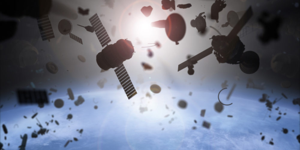 Satellites in space surrounded by debris