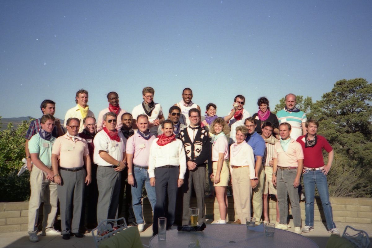 Group photo from the 1980s with Arizona mountains in the background