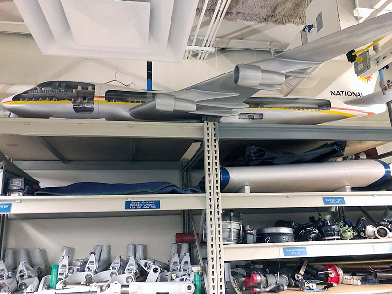 Model of a Boeing 747 aircraft hung above utility shelving inside an Embry-Riddle lab